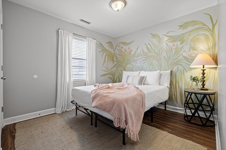 A local artist painted this mural during her stay. The bed is a queen.