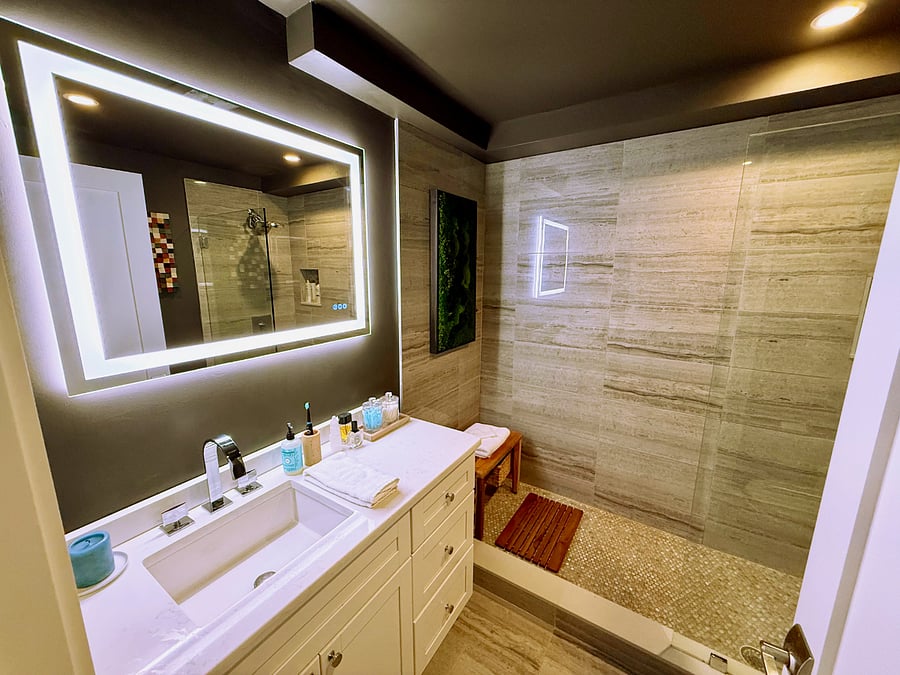 Master bathroom.  Urbane bronze finish with a moss wall accent + a beautiful walk-in shower with teak furniture. Shower has excellent water pressure!