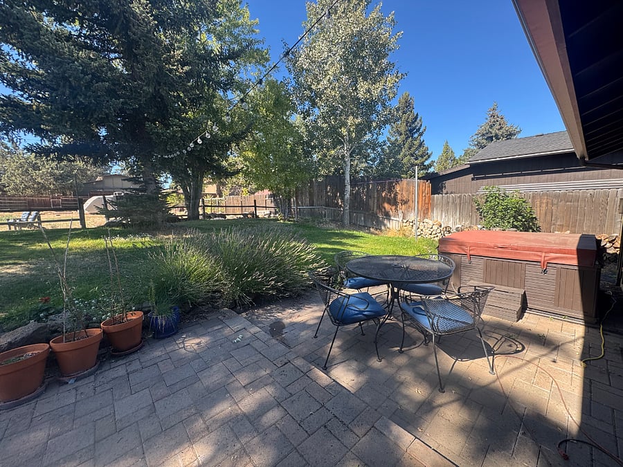 Pretty back yard, patio with wrought iron table and chairs. We may negotiate use of hot tub on back patio if you want to use it.