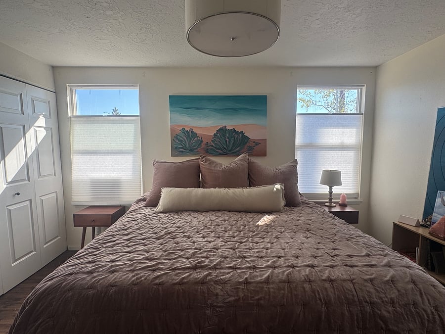 Cozy king bed in master bedroom.