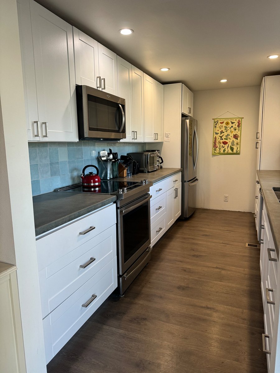 Newly remodeled kitchen with all the amenities, great storage and counter space, polished concrete countertops. Overlooks the sunny backyard.