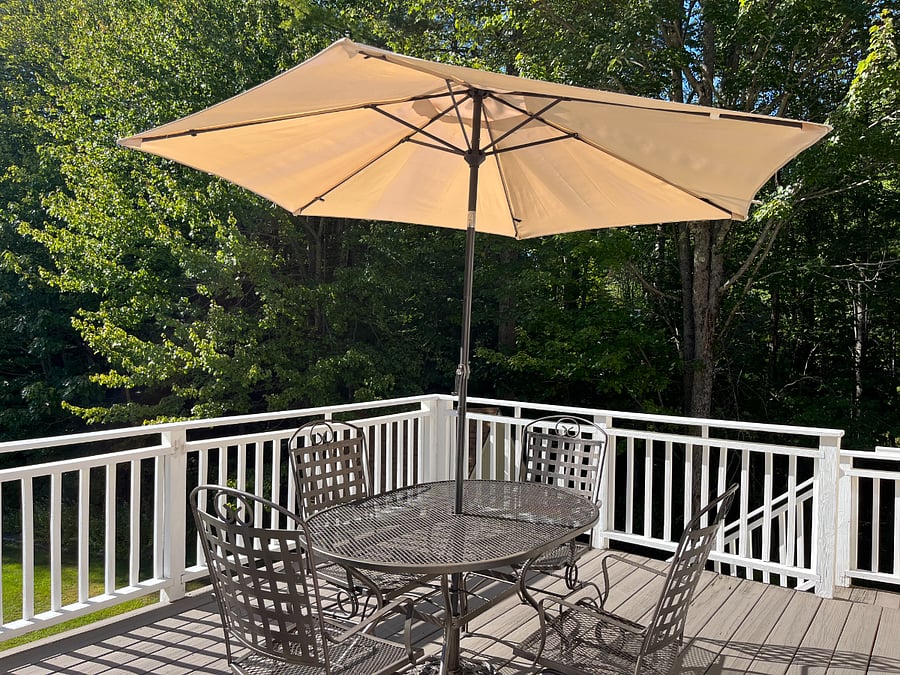 Private deck overlooking 2 acres of lawn and woods.