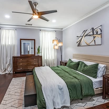 Primary room with king bed, ensuite bathroom with walk in shower, bathtub and walk-in closet