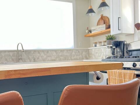 Kitchen Island opens up to a huge window. A favorite place for us to have breakfast. 