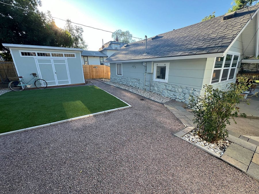 The back yard is home to the studio space along with a pet relief area. 