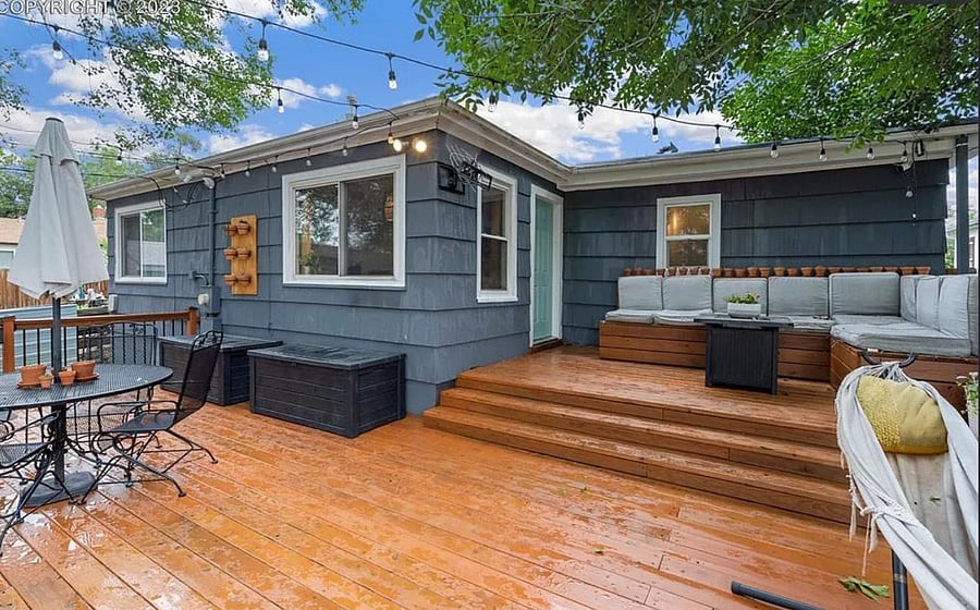 Beautiful and cozy outdoor patio with fire pit and stunning views of Pikes Peak