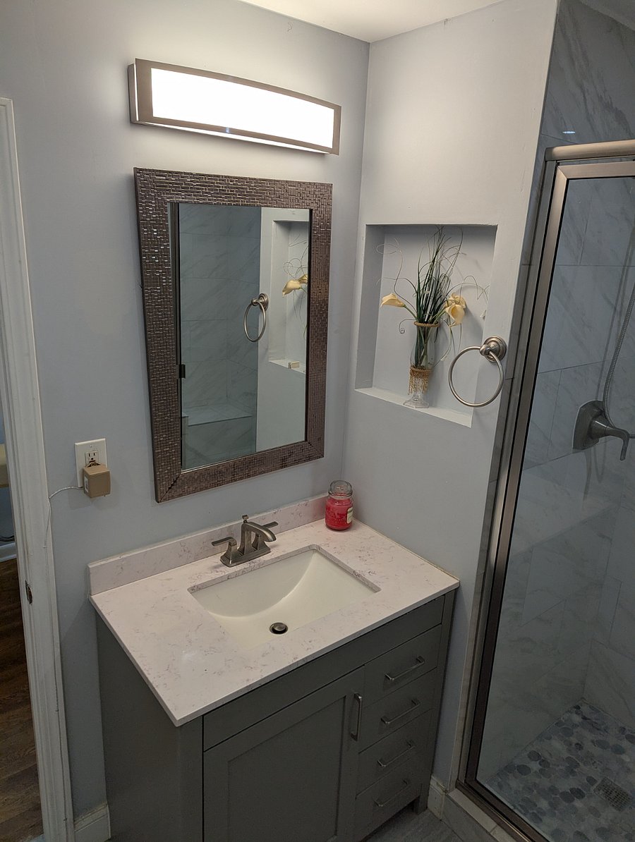 Get ready in the morning in style with this long vanity mirror.