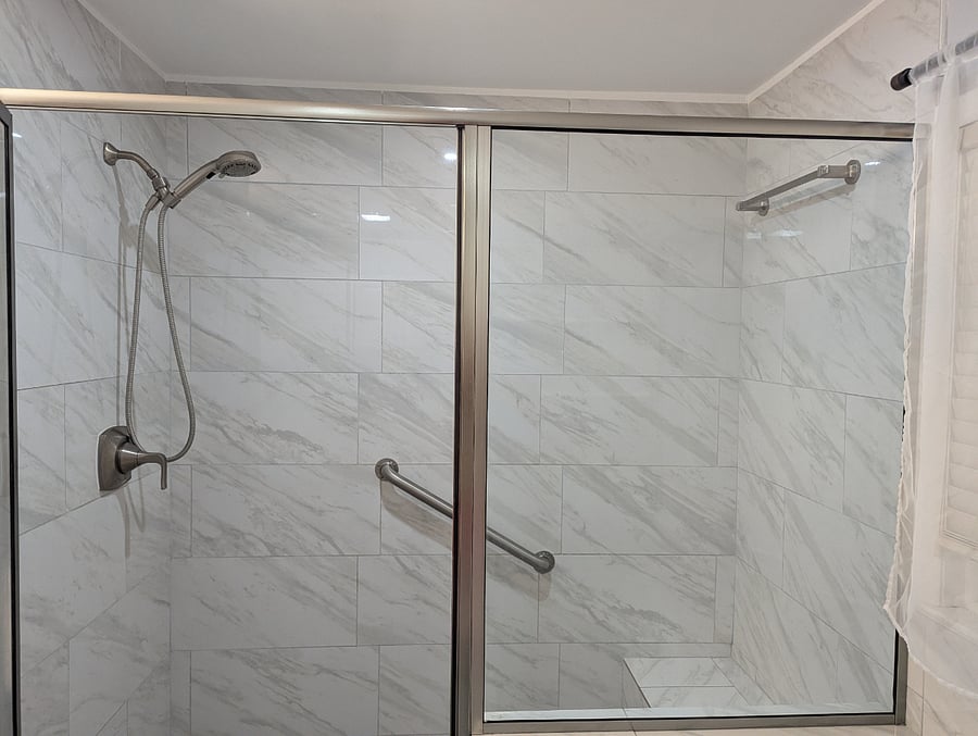 Treat yourself to a nice hot shower in this walk-in spa shower.