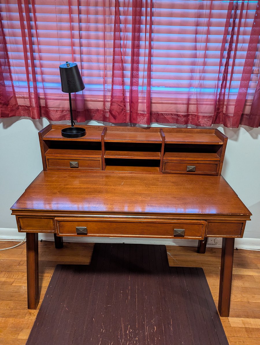 Master-Designated work space with a vintage desk with plenty of drawers.