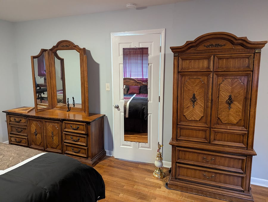 Master bedroom: Spacious room includes a dresser with a 3-sided mirror and armoire.