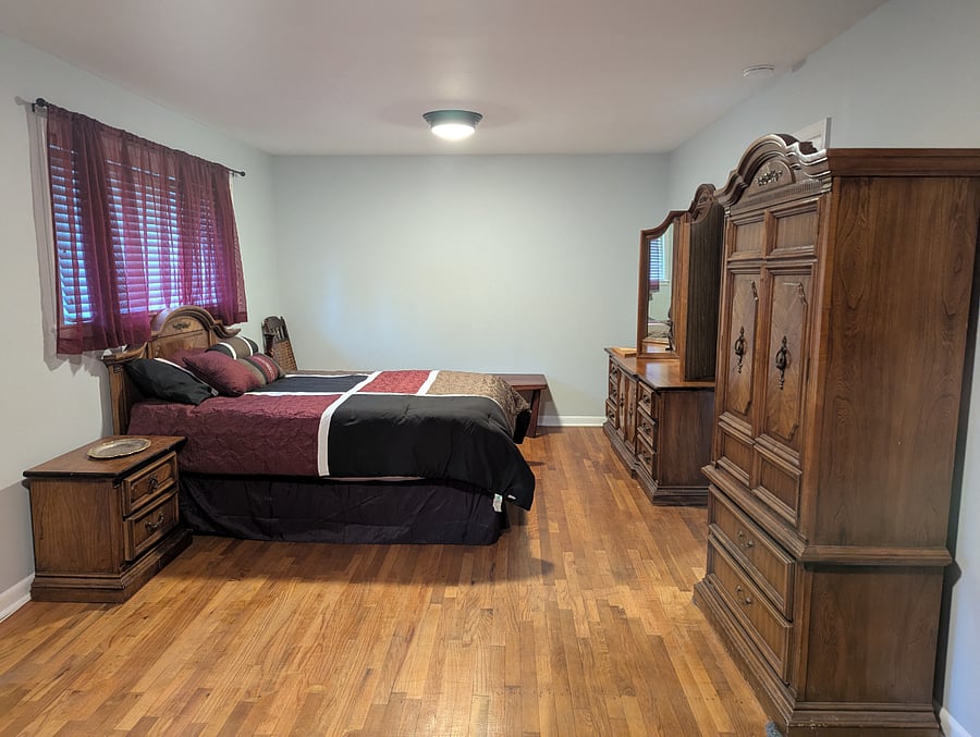 Master bedroom: Spacious room a dresser and armoire.