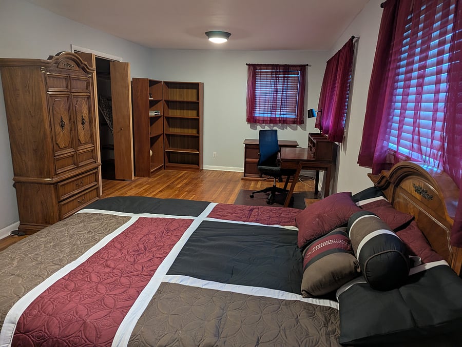 Master bedroom: Spacious room with dedicated work place, walk-in closet, 2 book shelves a dresser and armoire.