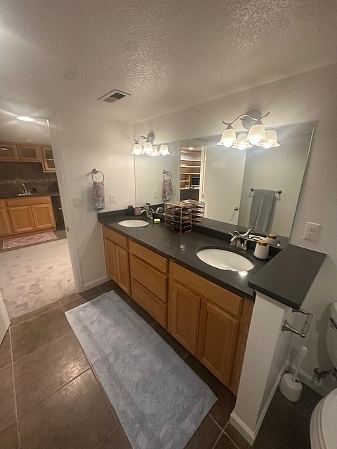 Large bathroom with dual sinks.