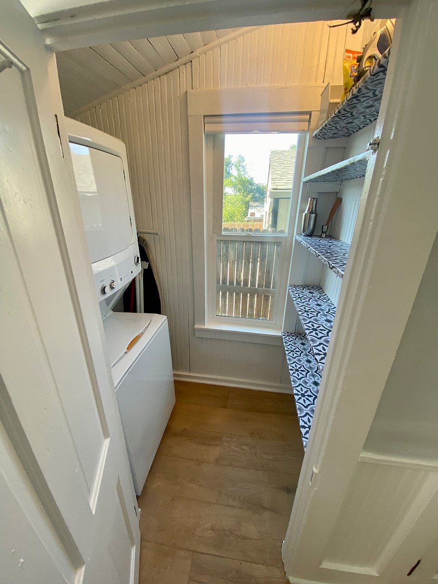 Washer, dryer, and storage off the kitchen.