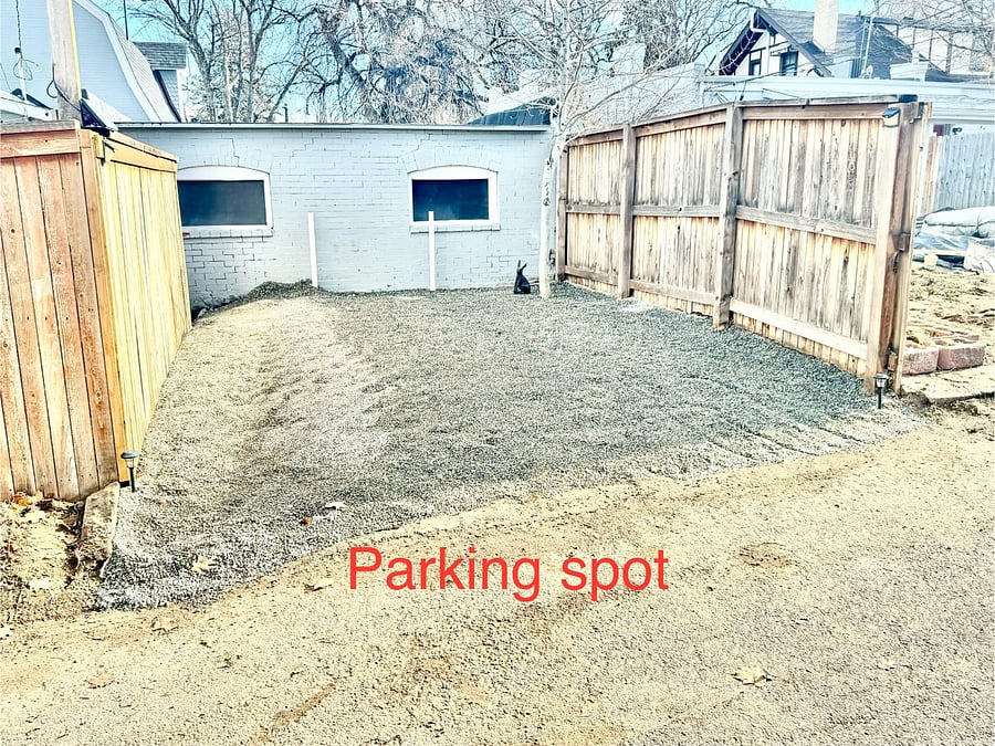 Single car dedicated parking spot on-site off alley.