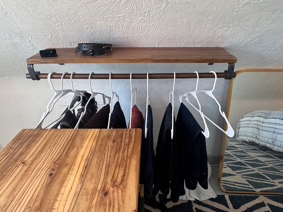 In early 2026, I added a 3-foot-long shelf with a clothing bar to provide additional clothing storage, along with a large mirror. The pictured dresser and small freestanding clothing unit are still available for tenant use.