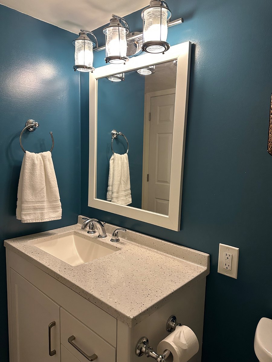 Vanity has enough counter space for every day items.