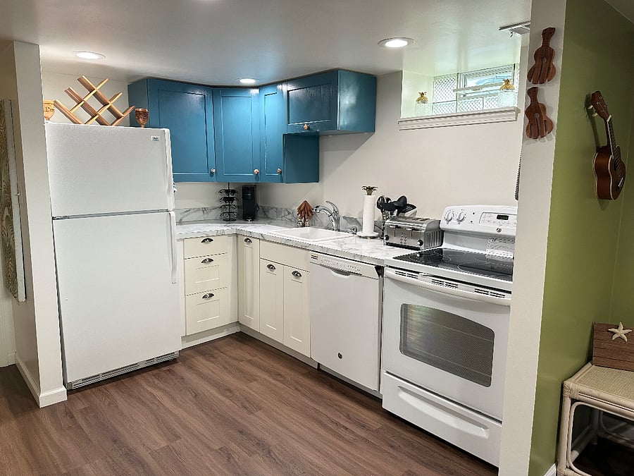 Full sized kitchen with food pantry closet, and everything you need to prepare meals at home.