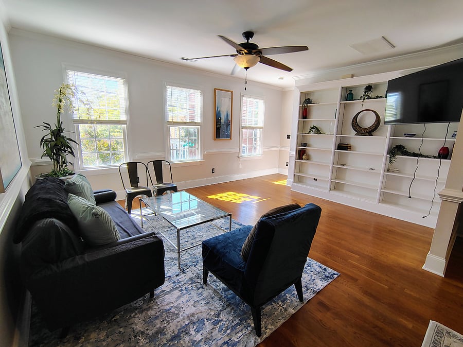 living room is tastefully decorated and features a 55 in smart tv