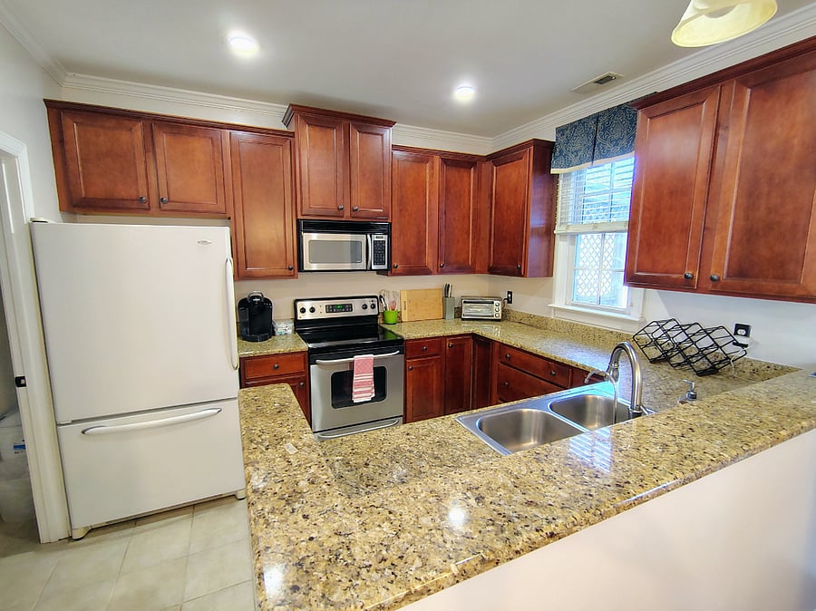 Kitchen has granite counter tops and all essentials