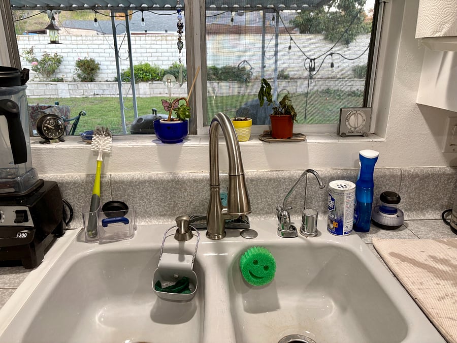 Kitchen sink and view of back yard