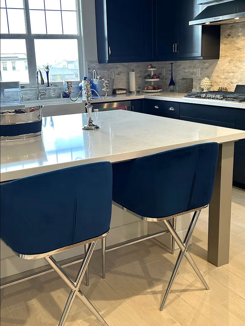 Kitchen island with 1940s style velvet seating.