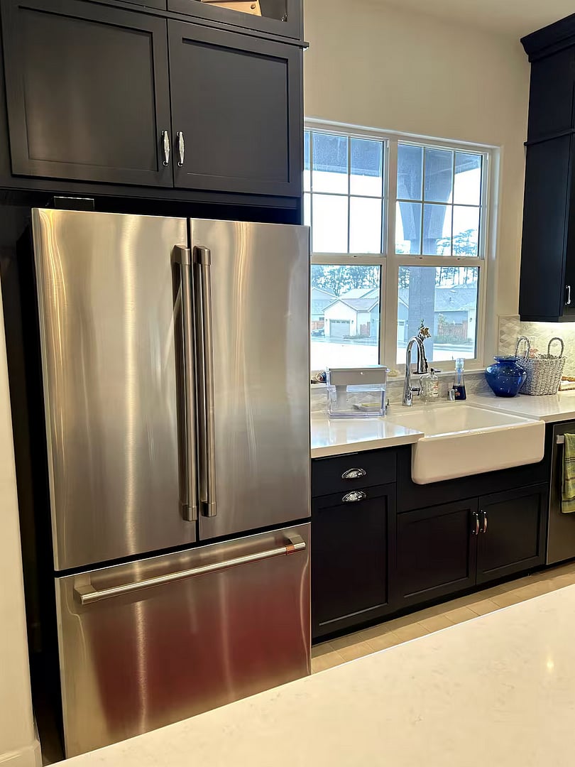 Large stainless steel fridge with filtered water.