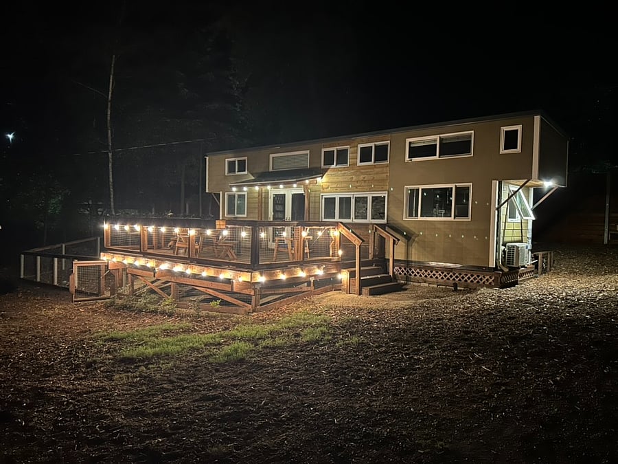 Enjoy the deck at night with dimmable lighting or by the glass fire pit table.