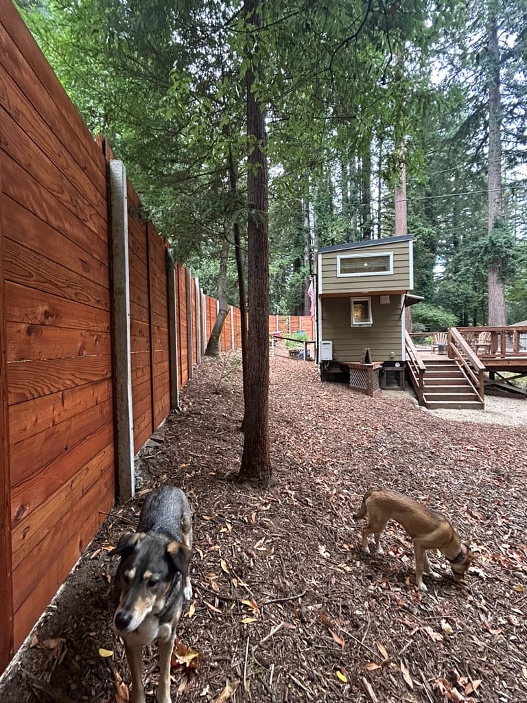 The front of the property is protected by an 8' redwood privacy fence with a motorized redwood entry gate.
