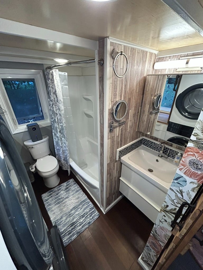 Enjoy a shower or bath in the full size tub, and the toilet is a standard water flushable with a bidet attachment.
