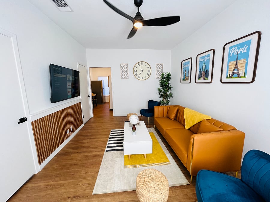 Comfortable Living Room with Wall-Mounted Flat Screen Smart TV