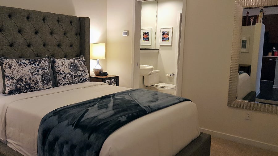 Desk in bedroom with outlets and USB chargers for your computer and writing needs.
