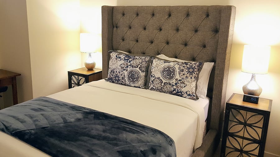 Super comfy queen size bed with memory foam topper and luxurious linens (extra sets provided).
