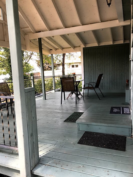 Spacious covered porch with water view expands living area