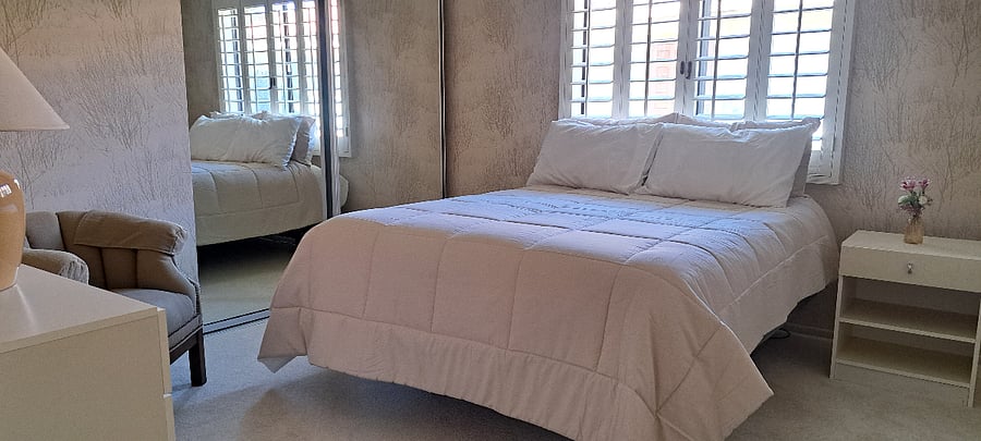 Bedroom with new adjustible queen bed | can be configured with twin beds as well   New linens & towels 