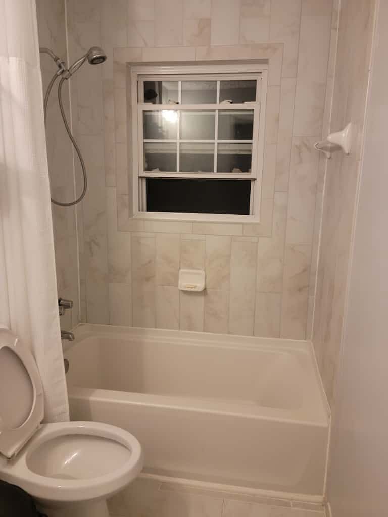 Clean, modern bathroom shared with one respectful professional  well-kept and stocked with daily essentials.