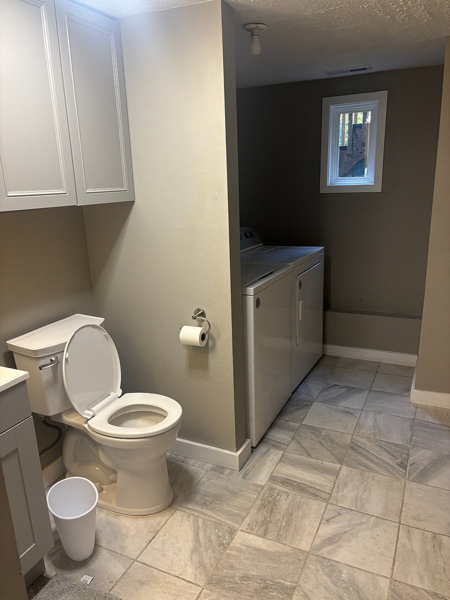 Downstairs bathroom with washer and dryer