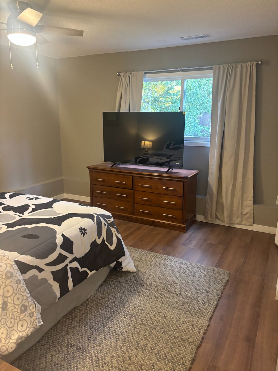 Downstairs bedroom with a queen-size bed