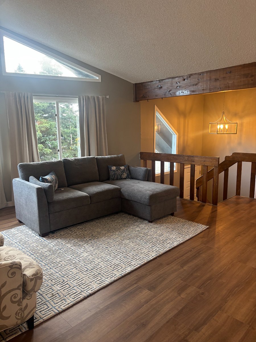 Main Living room with a sofa sleeper, queen bed