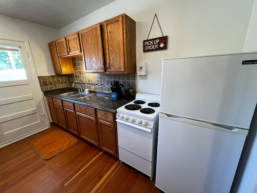 Light, bright large kitchen with backdoor to private patio