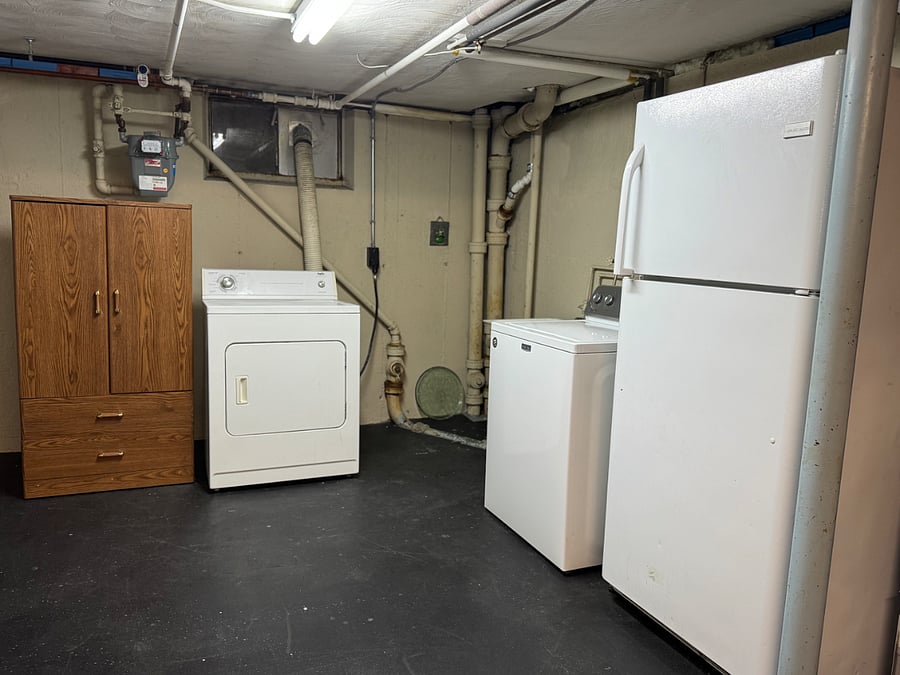 washer/dryer and spare fridge in the baseman