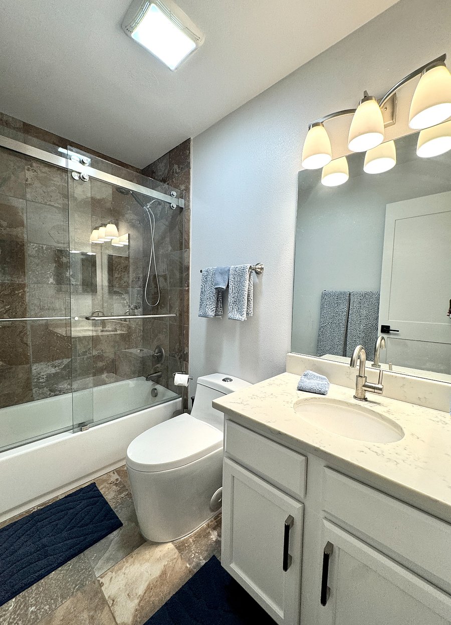 2nd bathroom w/ tub and shower combo.