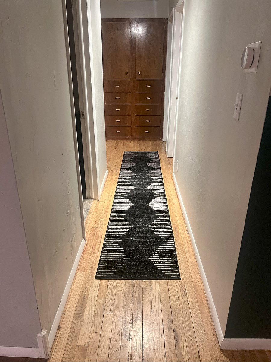 Built-ins for storage at the end of hallway.