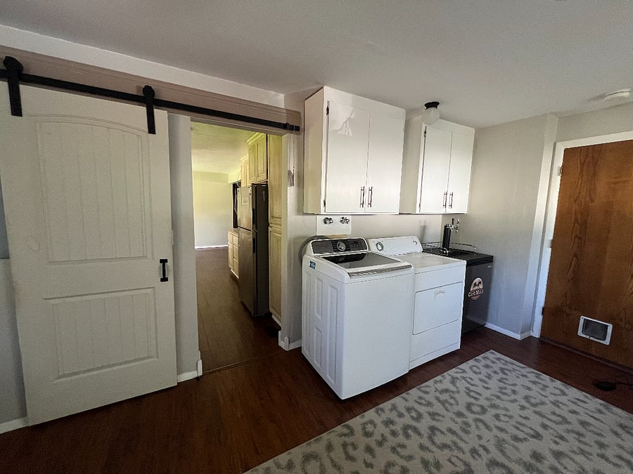Sliding barn door converts this room into a private sleeping space.