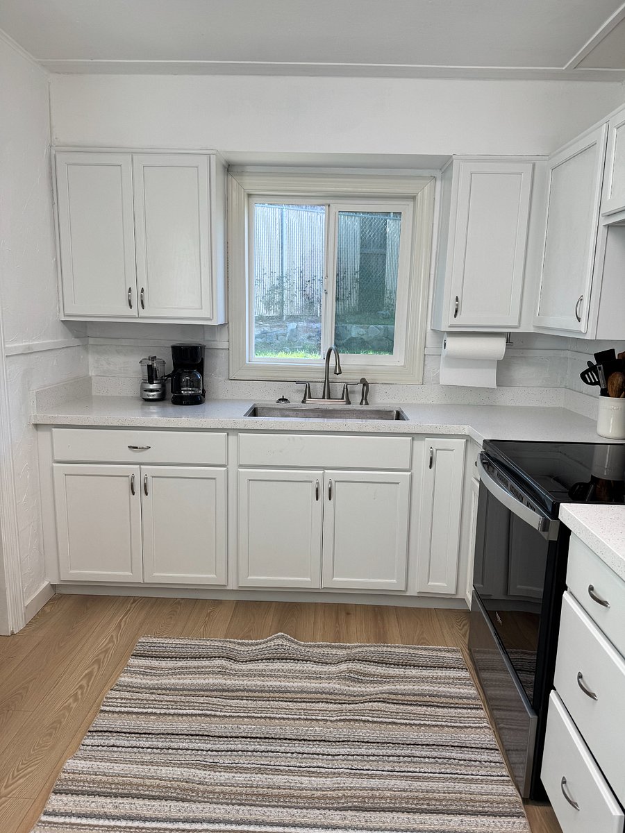 Kitchen window overlooking private fully fenced backyard