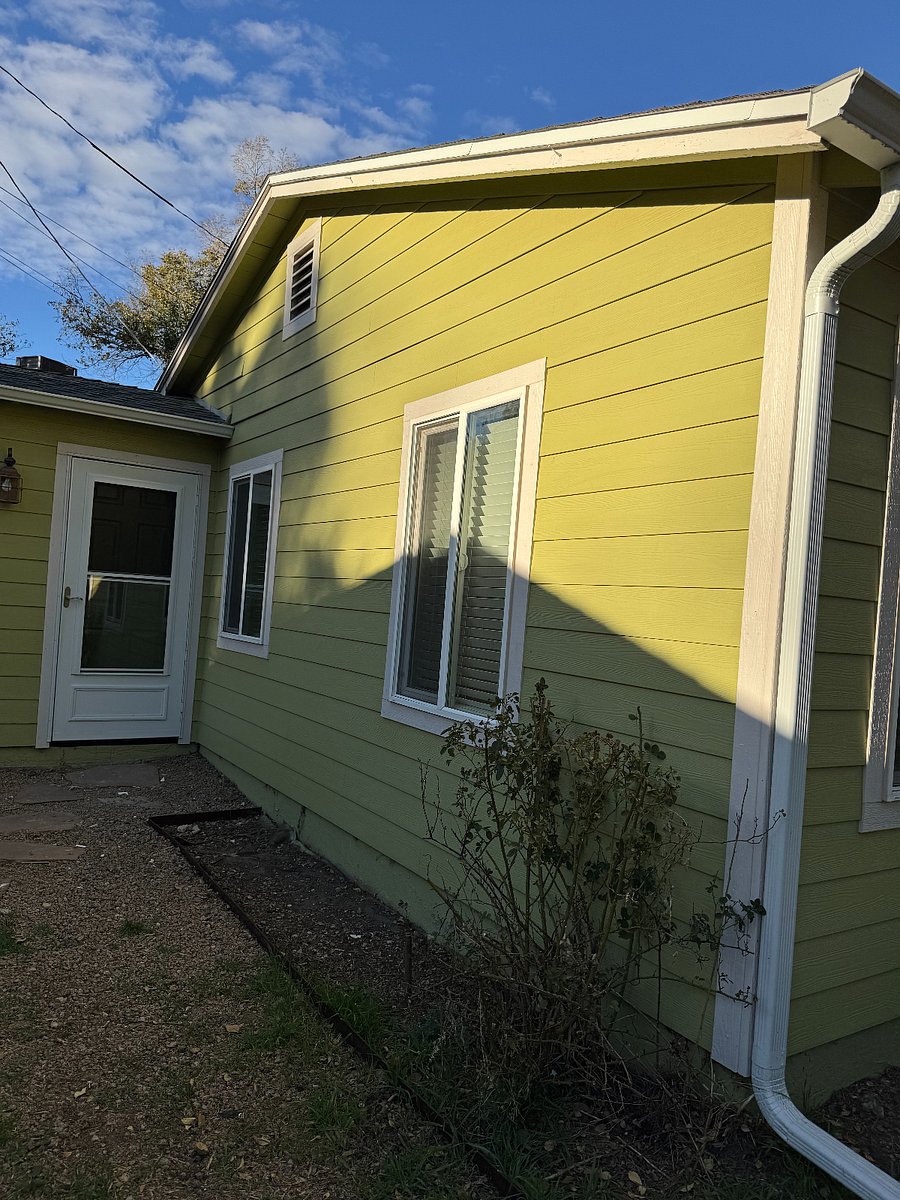 Side yard in front looking at laundry room door