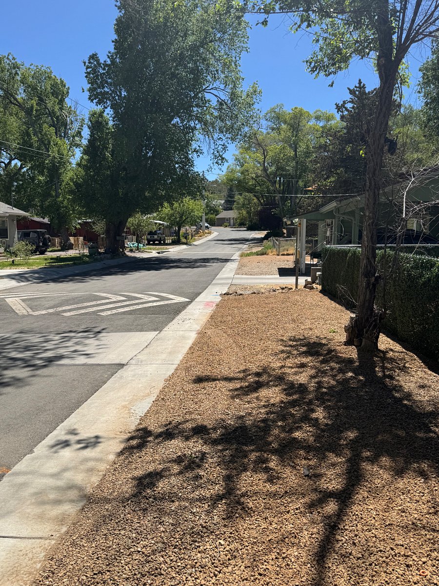 View down the street, our home is on the right. Quiet small tree lined street