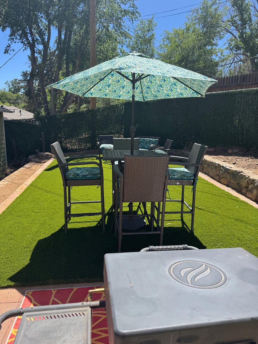 Dining table for four with umbrella