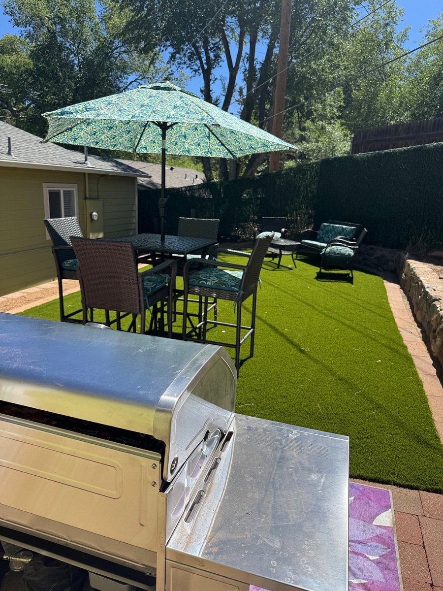 View of table and sitting area in backyard