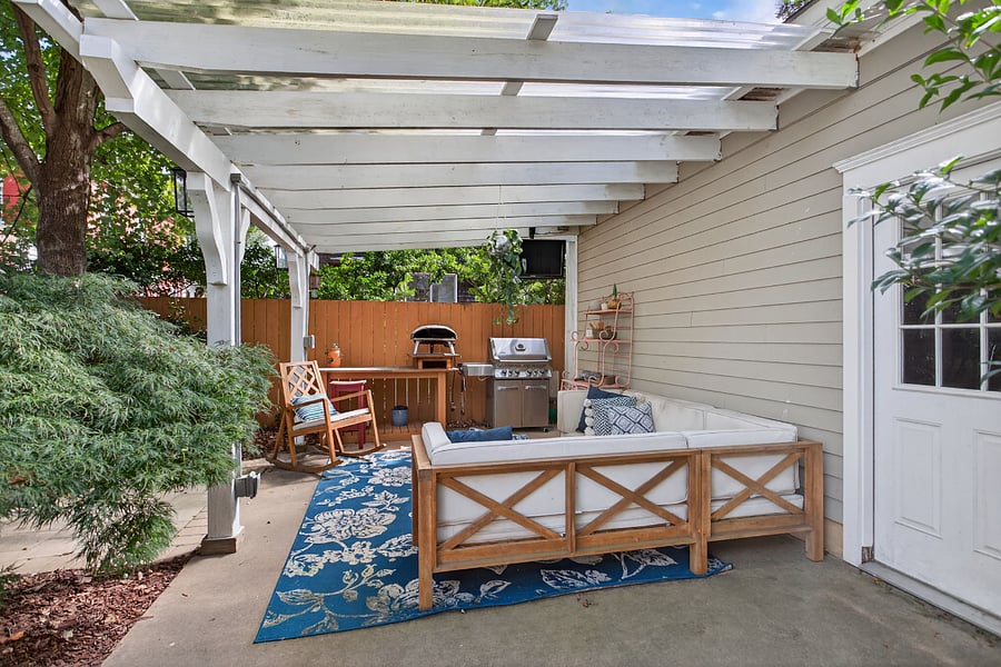 Cozy outdoor patio with dining and LR seating and TV